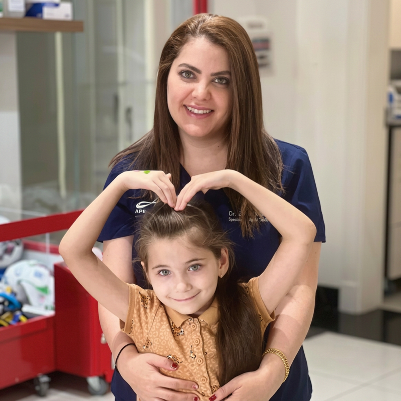 Child smiling at pediatric dentist in Dubai